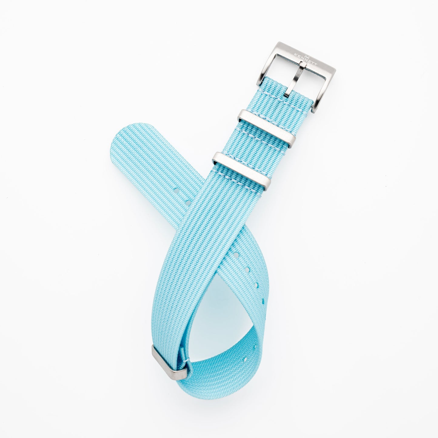 Kennett Ribbed Nylon NATO Strap in light blue with stainless steel buckle, 22mm width for versatile watch styles.