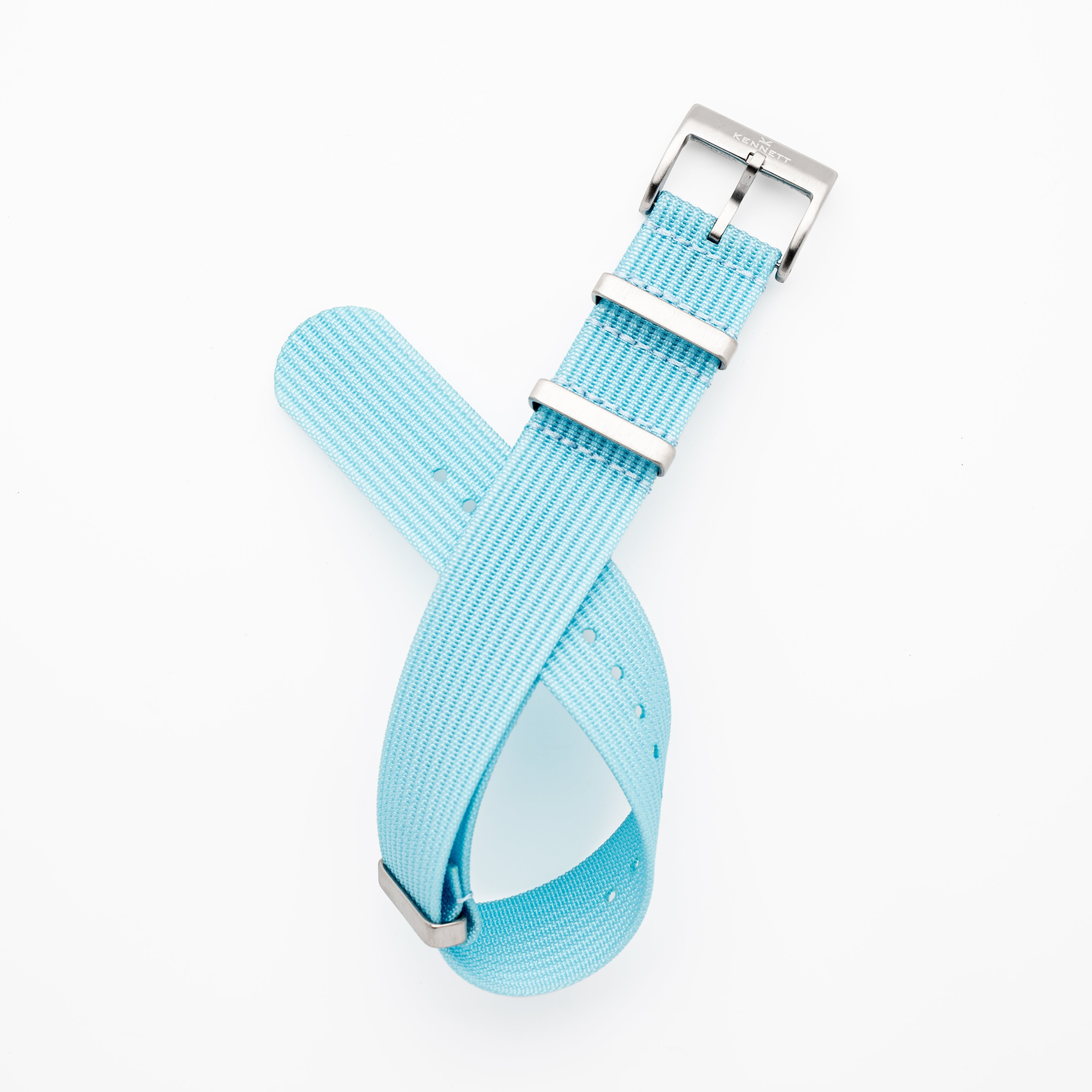 Kennett Ribbed Nylon NATO Strap in light blue with stainless steel buckle, 22mm width for versatile watch styles.