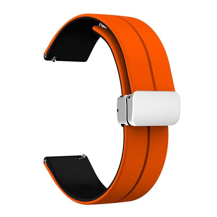 Two-color silicone watch strap with quick release and folding clasp, orange exterior, black underside.