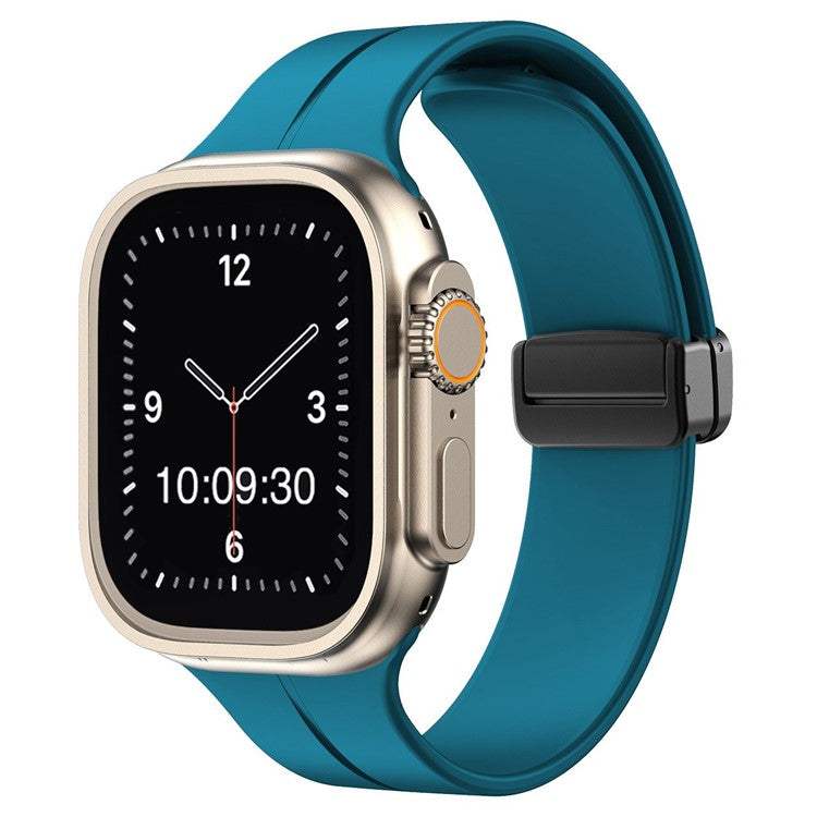 Plain magnetic silicone sport Apple Watch strap in blue, compatible with all sizes and generations, featuring a secure pin and tuck closure.