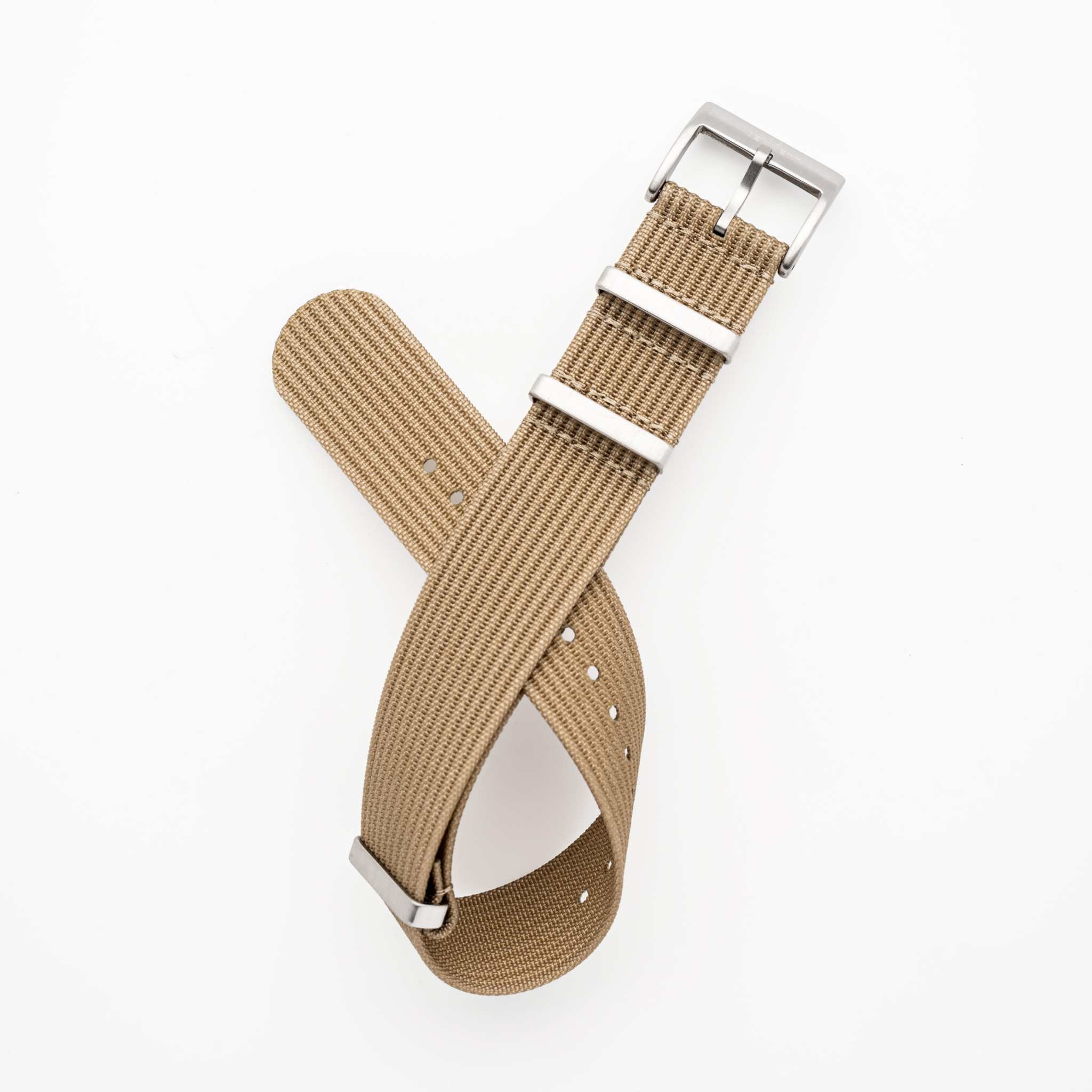 Kennett ribbed nylon NATO watch strap with stainless steel buckle, 22mm width, in tan color.